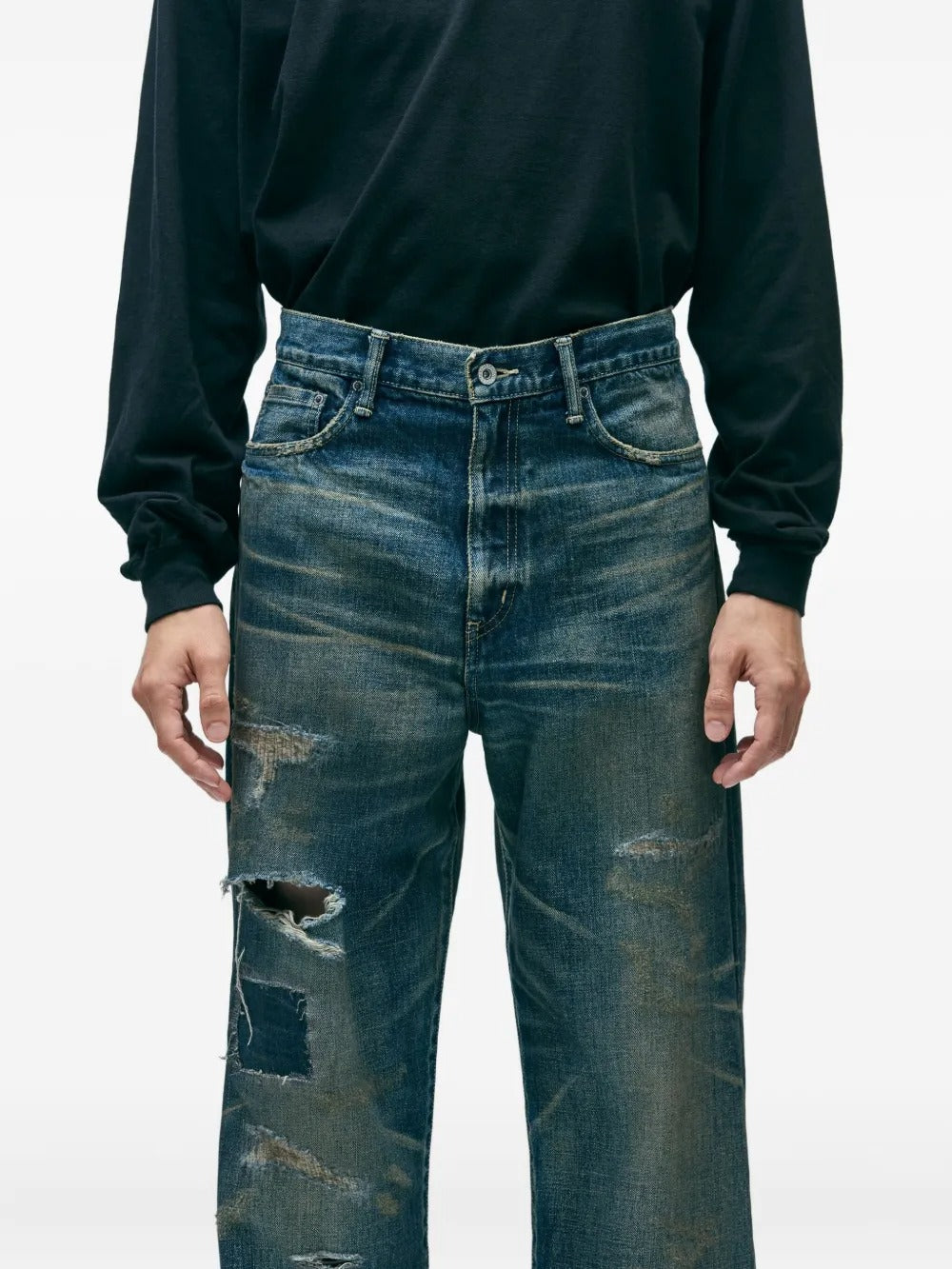 Blue pants worn by a person, showing the pants's fit