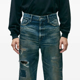 Blue pants worn by a person, showing the pants's fit