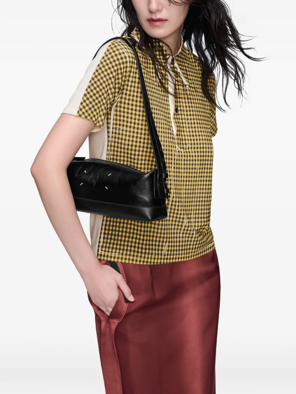 black bags worn by a person, showing the bags fit