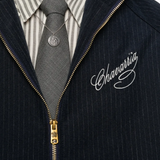 Close up of blue jacket, showing texture of the polyester fabric