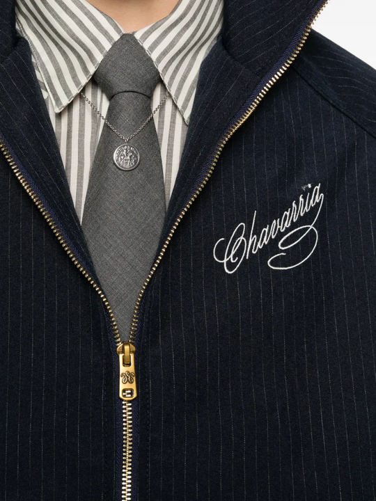Close up of blue jacket, showing texture of the polyester fabric
