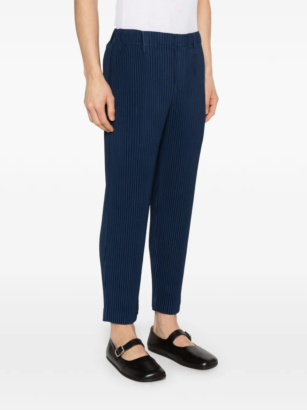 blue pants worn by a person, showing the pants fit