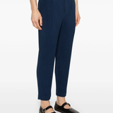 blue pants worn by a person, showing the pants fit