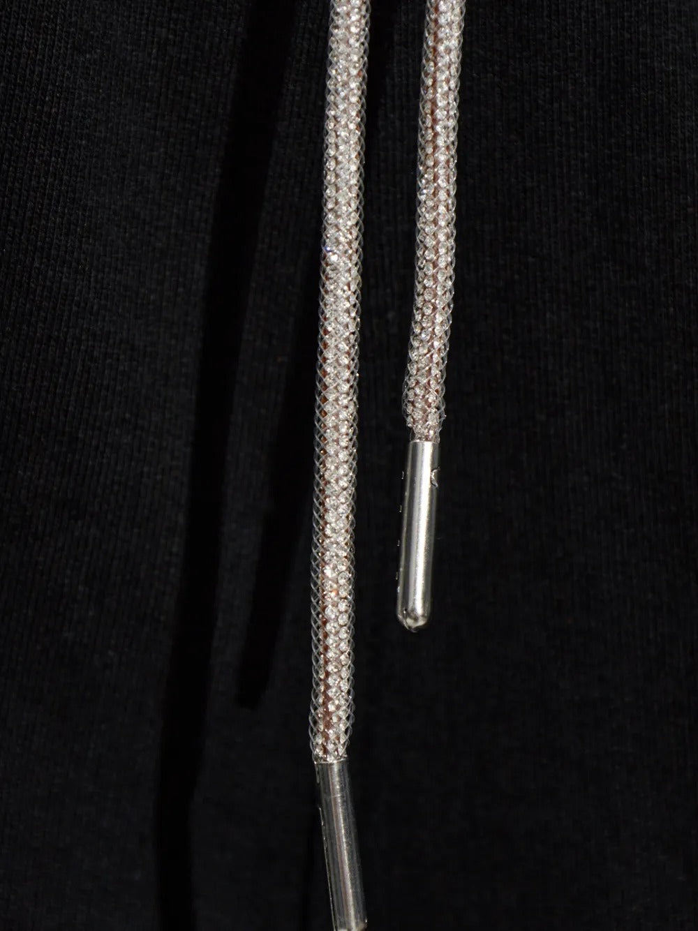 Close up of black pants, showing texture of the cotton fabric