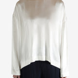 white long-sleeve shirt worn by a person, showing the shirt fit