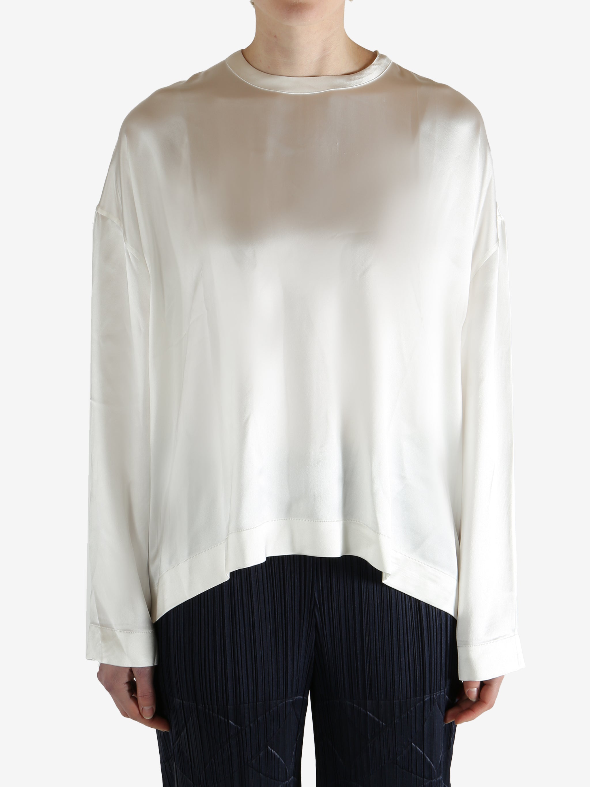 white long-sleeve shirt worn by a person, showing the shirt fit