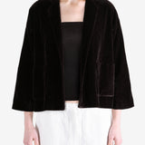 Black jacket worn by a person, showing the jacket fit