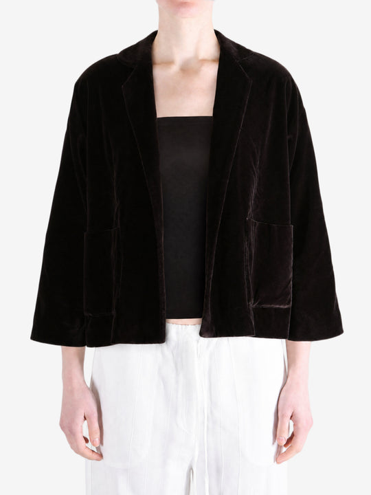 Black jacket worn by a person, showing the jacket fit