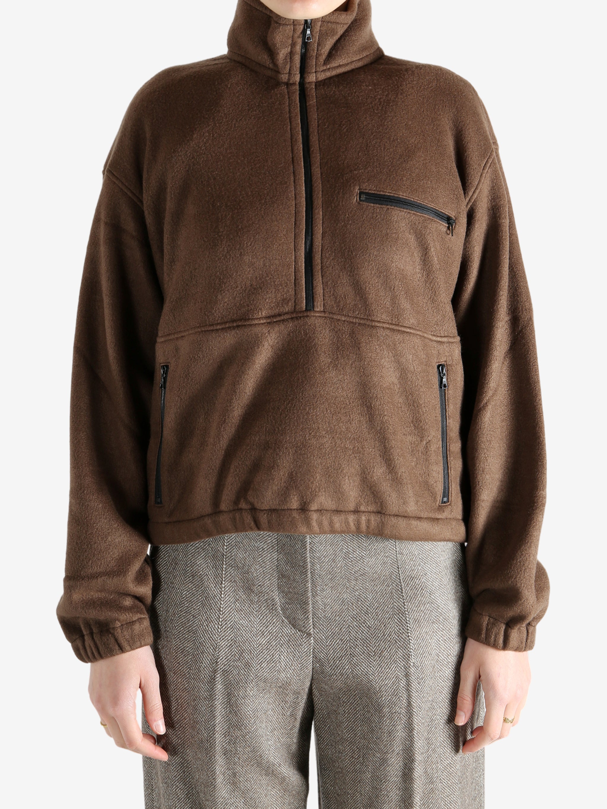 Brown jackets worn by a person, showing the jackets fit