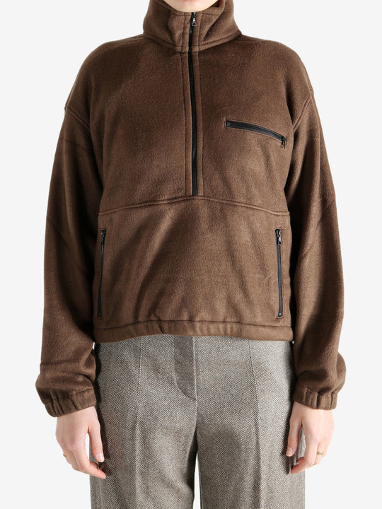 Brown jackets worn by a person, showing the jackets fit