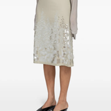 Tan skirts worn by a person, showing the skirts fit