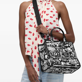 Black bag worn by a person, showing the bag's fit