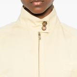 Close up of tan skirt, showing texture of the cotton fabric