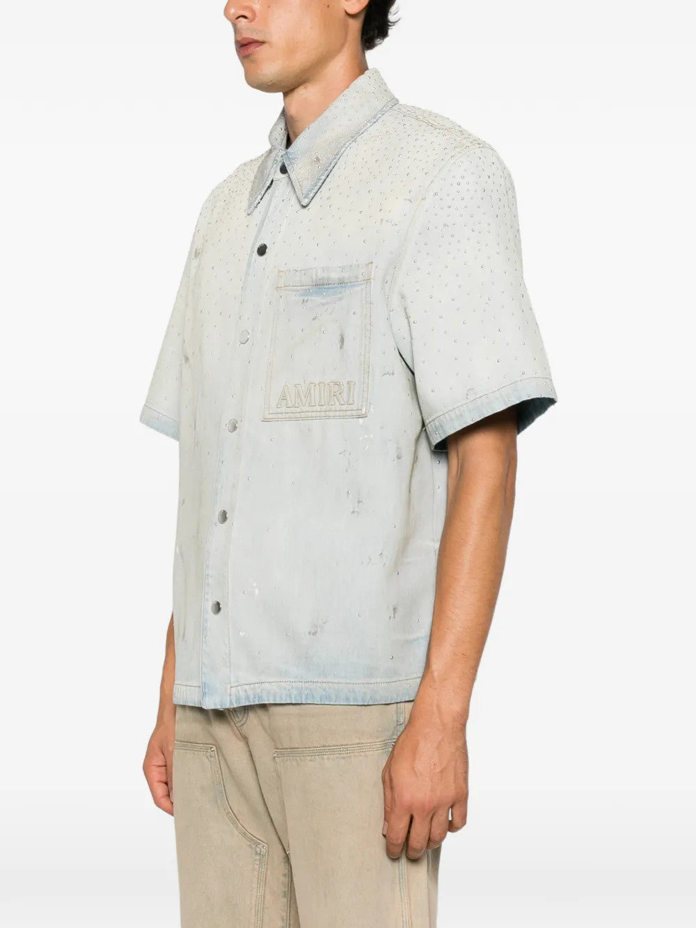 Blue shirt worn by a person, showing the shirt fit
