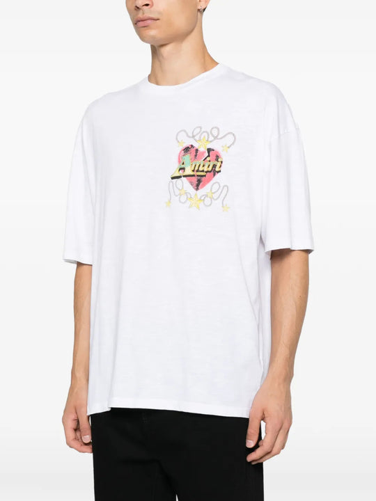 White t-shirt worn by a person, showing the t-shirt fit