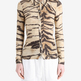 Tan shirt worn by a person, showing the shirt fit