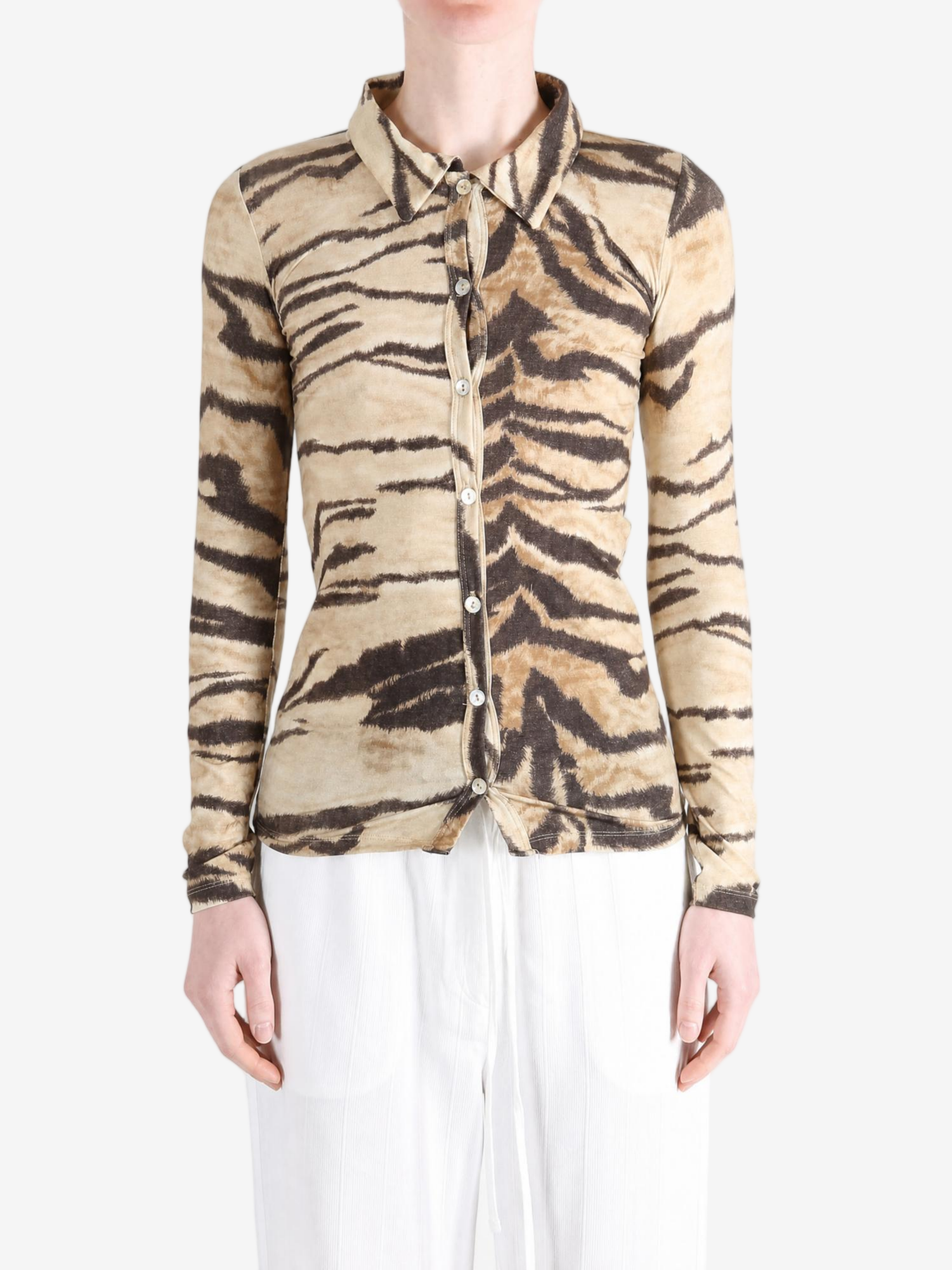 Tan shirt worn by a person, showing the shirt fit