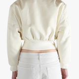 White jackets worn by a person, showing the jackets fit