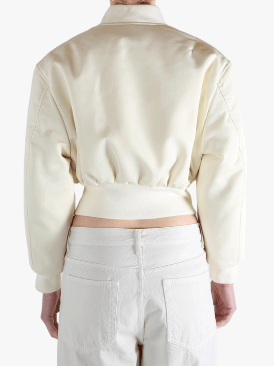 White jackets worn by a person, showing the jackets fit