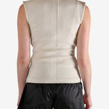 White top worn by a person, showing the top's fit