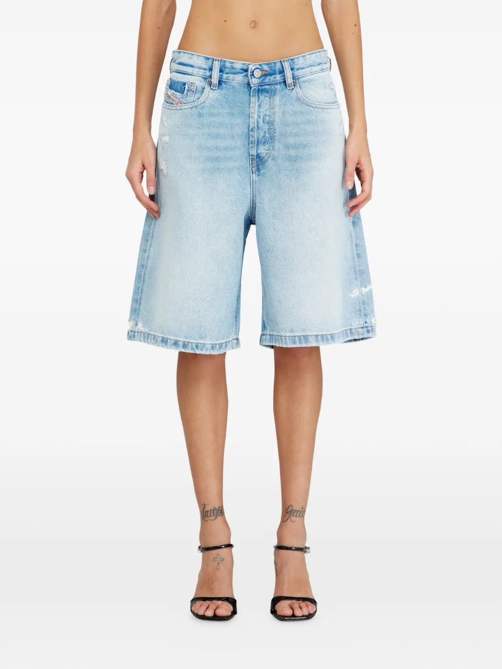 Blue shorts worn by a person, showing the shorts fit