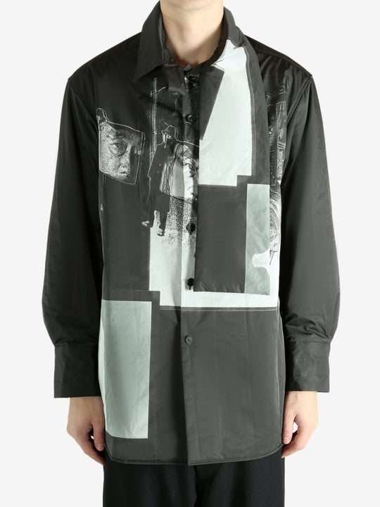 Black coat worn by a person, showing the coat's fit