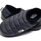 Close up of grey shoes, showing texture of the fabric