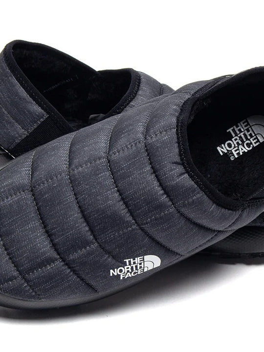 Close up of grey shoes, showing texture of the fabric