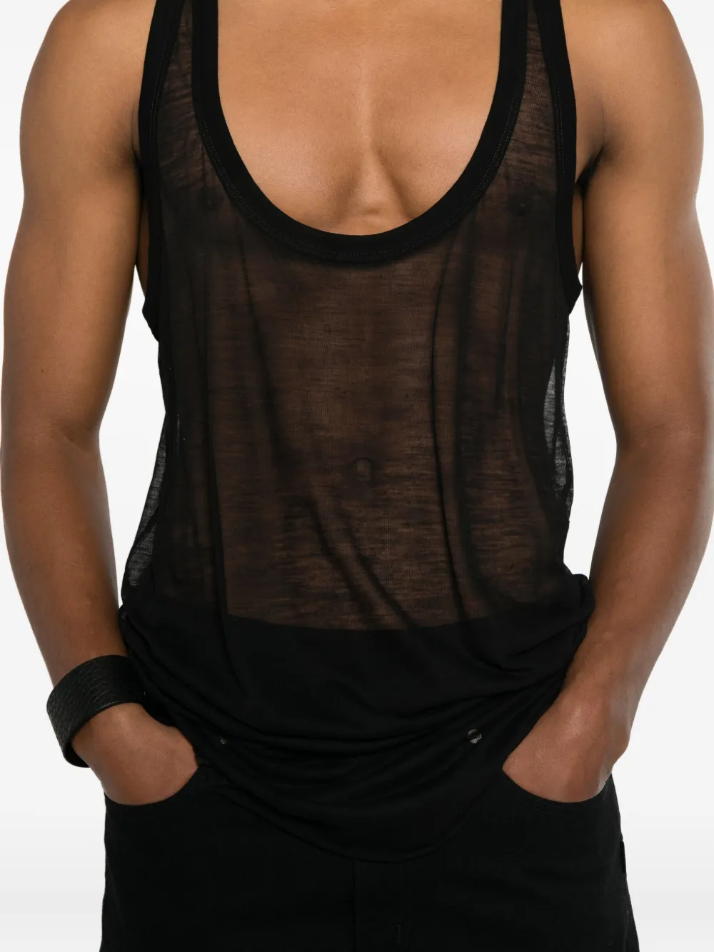 Black top worn by a person, showing the top fit