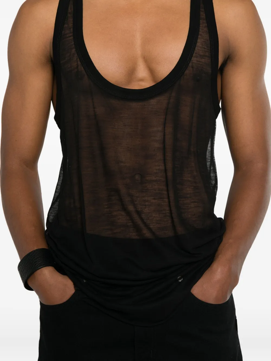 Black top worn by a person, showing the top fit