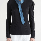 Black shirt worn by a person, showing the shirt fit
