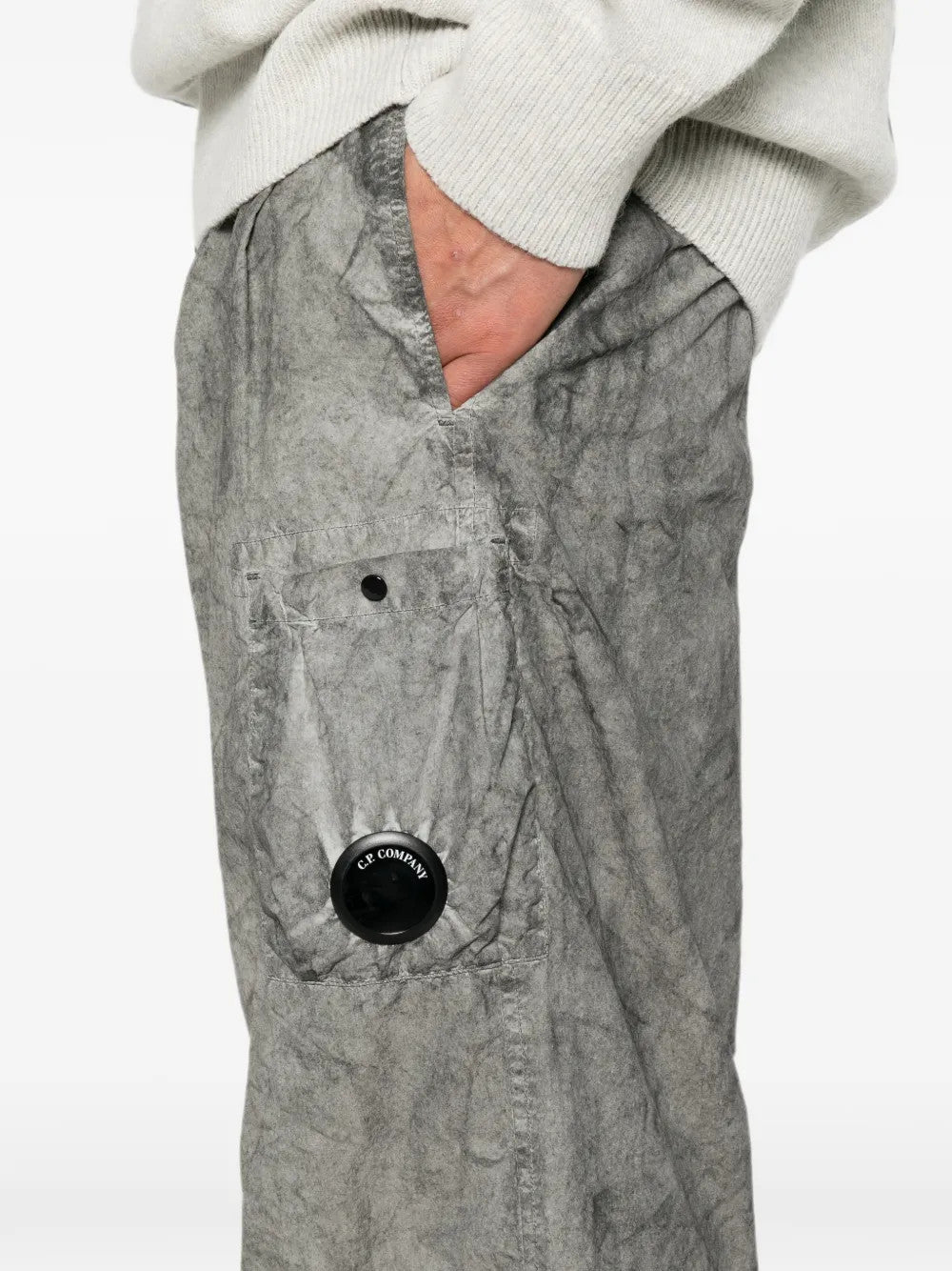 Grey pants worn by a person, showing the pants fit