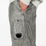 Grey pants worn by a person, showing the pants fit