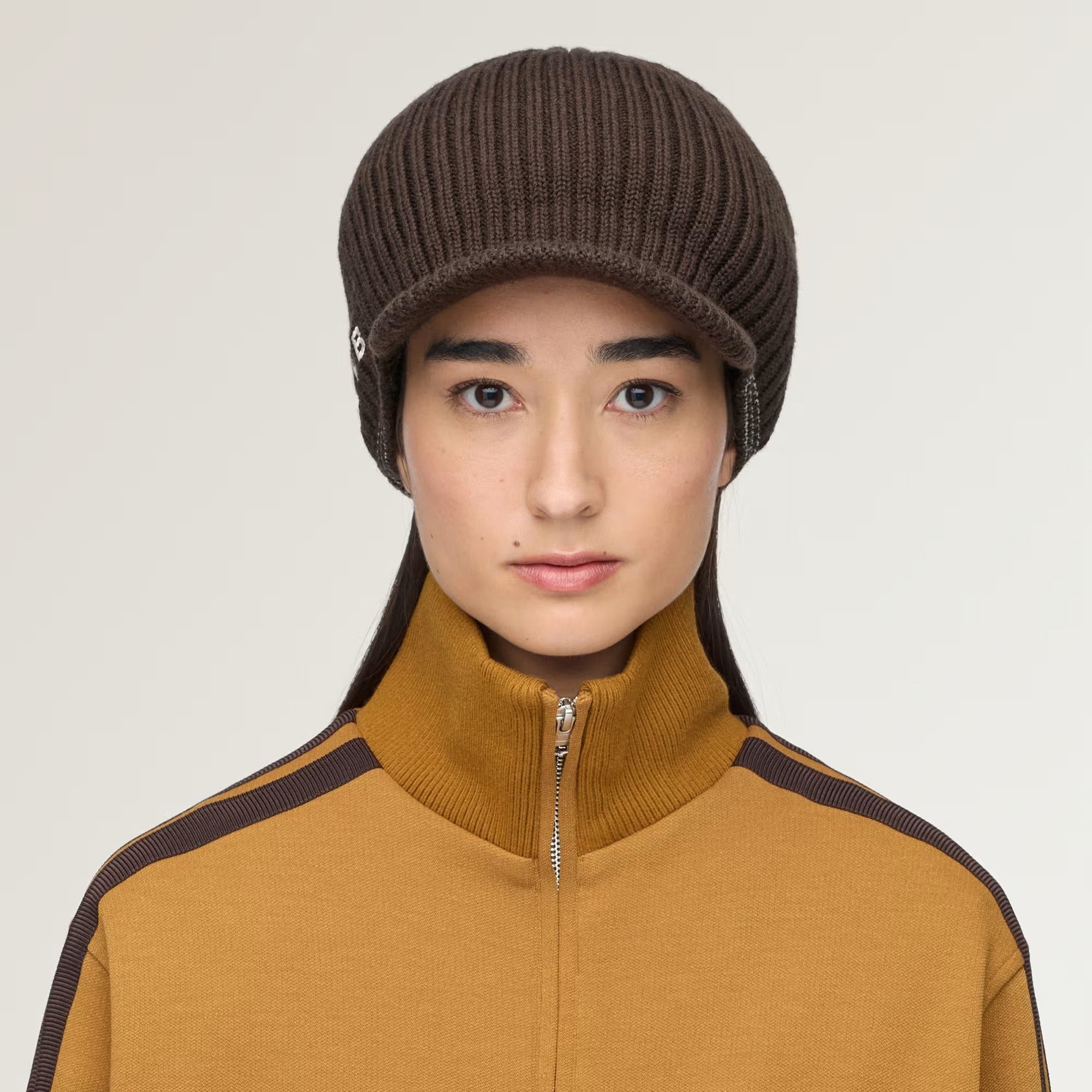 Brown hat worn by a person, showing the hat fit