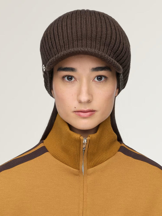 Brown hat worn by a person, showing the hat fit