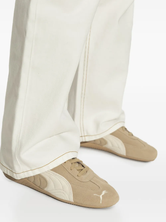 Tan shoes worn by a person, showing the shoes's fit