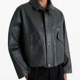 Black jacket worn by a person, showing the jacket's fit