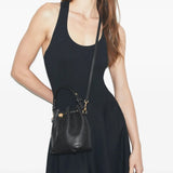 Black bag worn by a person, showing the bag's fit