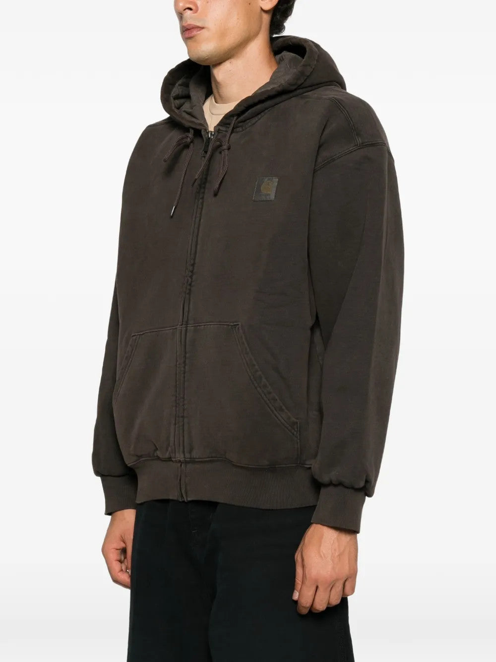 Brown jacket worn by a person, showing the jacket fit