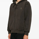 Brown jacket worn by a person, showing the jacket fit