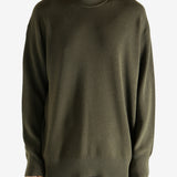 Crew knitwear worn by a person, showing the knitwear's fit