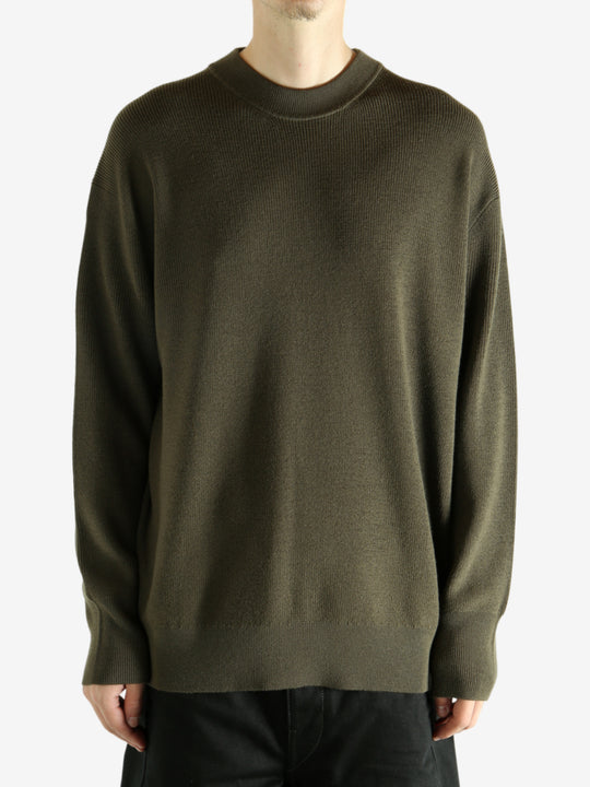 Crew knitwear worn by a person, showing the knitwear's fit