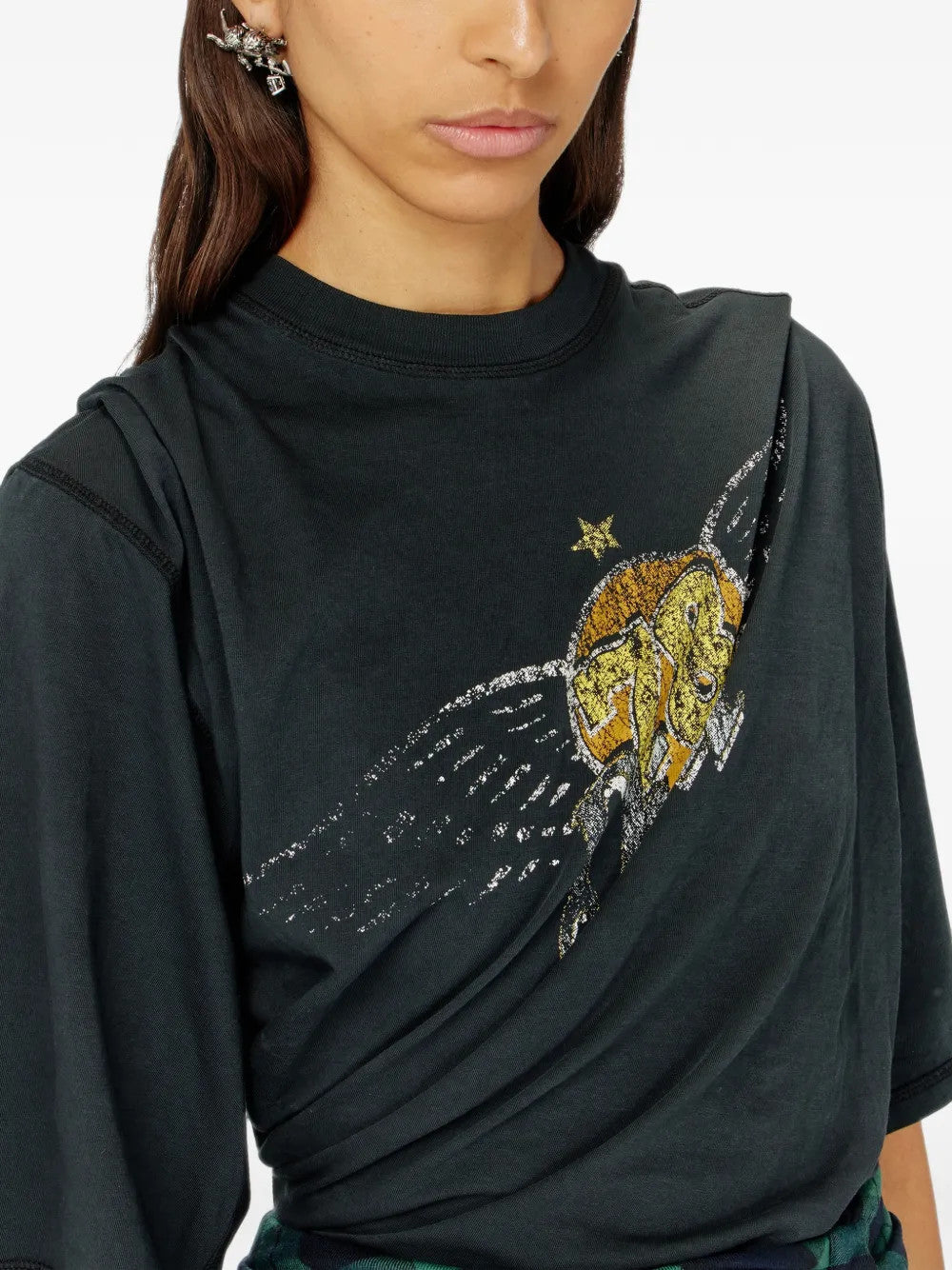 Black t-shirt worn by a person, showing the t-shirt fit