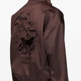 Close up of brown jacket, showing texture of the recycled polyester fabric