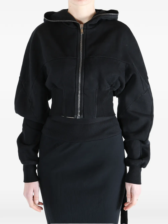 Black hoodie worn by a person, showing the  hoodie fit