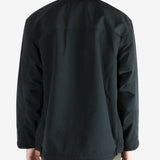 Black jacket worn by a person, showing the jacket's fit