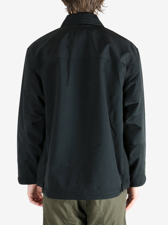 Black jacket worn by a person, showing the jacket's fit