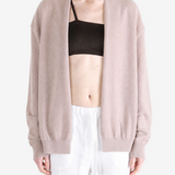 Tan knitwear worn by a person, showing the knitwear fit