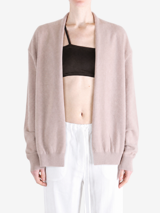 Tan knitwear worn by a person, showing the knitwear fit