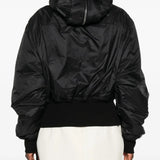 Black jacket worn by a person, showing the jacket's fit